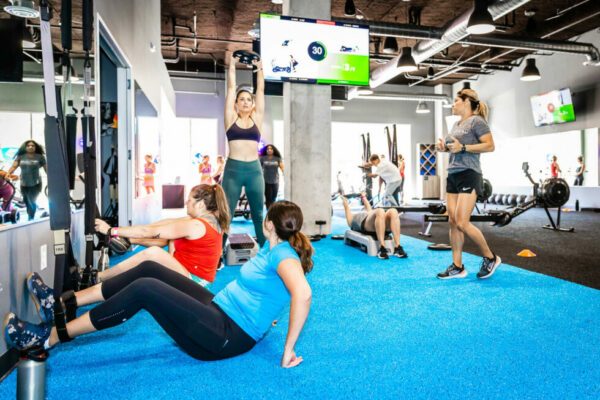 fitness gym class group diverse SWEAT440