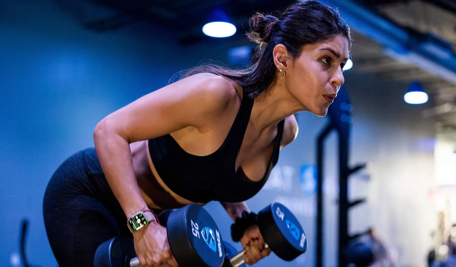 SWEAT440 South Miami member training with dumbbells