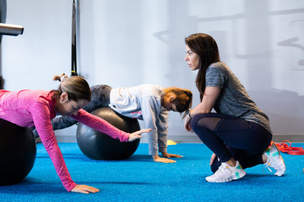 SWEAT440 Doral member coach and member working out gym class