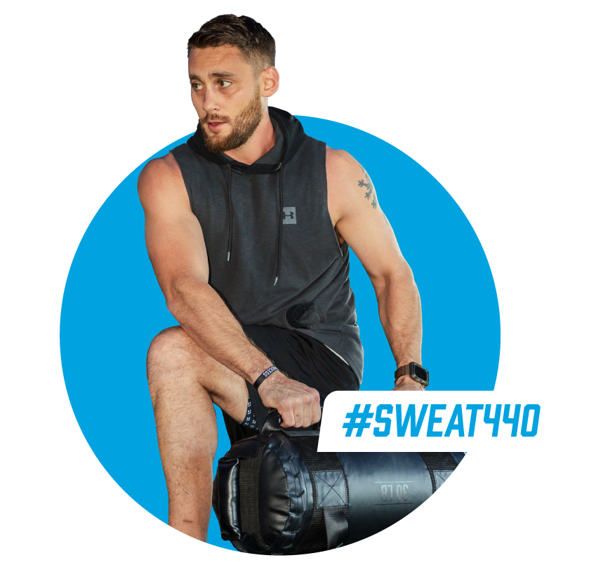 Man working out SWEAT440 class Man working out SWEAT440 class